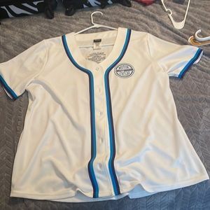 White and Blue baseball jersey style woman’s shirt.
